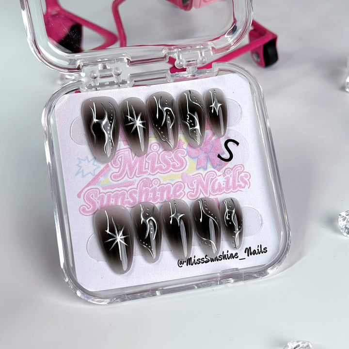Handcrafted mystical nails with a dark cosmic design