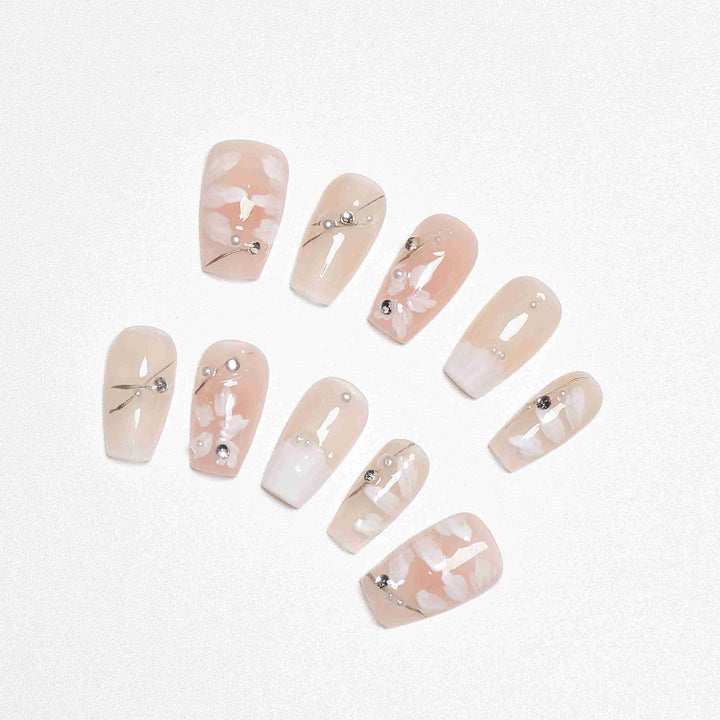 Clean girl wedding nails with subtle floral beauty