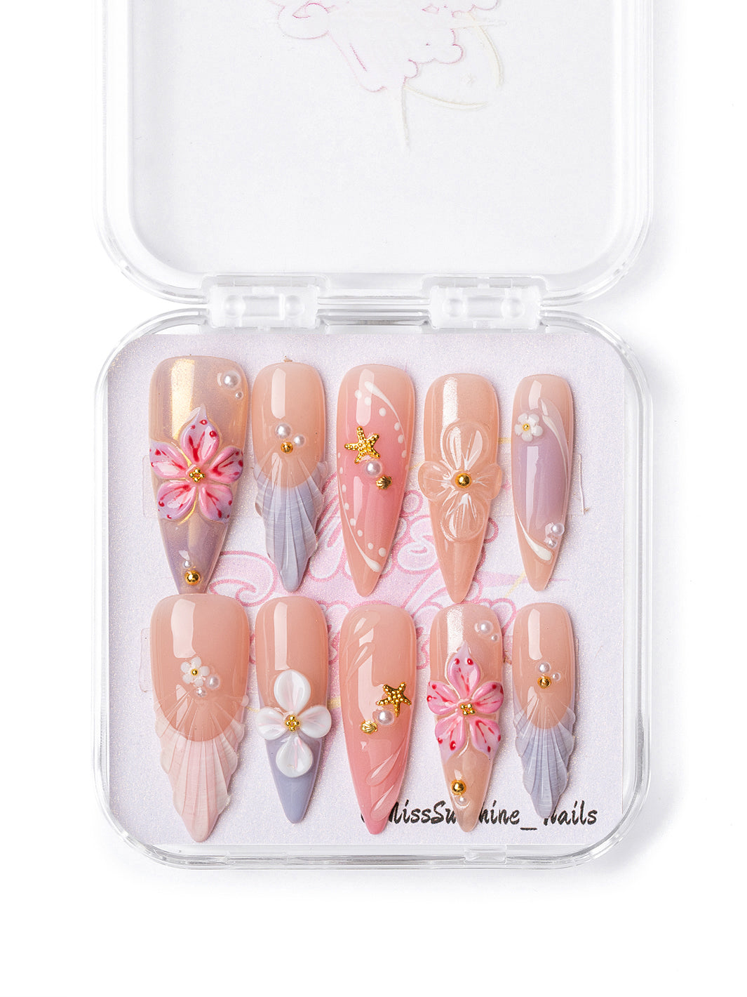 Coral Mermaid press-on nails with seashell textures, tropical flowers, and pearl accents