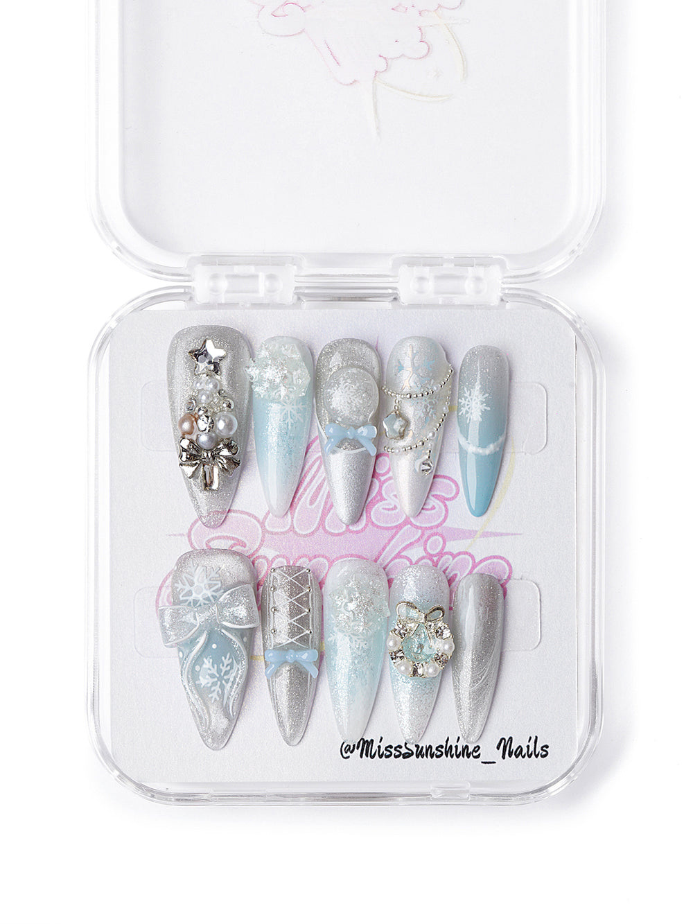 Winter holiday press-on nails with blue gradients, glitter, and 3D gem embellishments