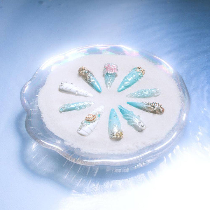 Long stiletto press-on nails with seashell and pearl details