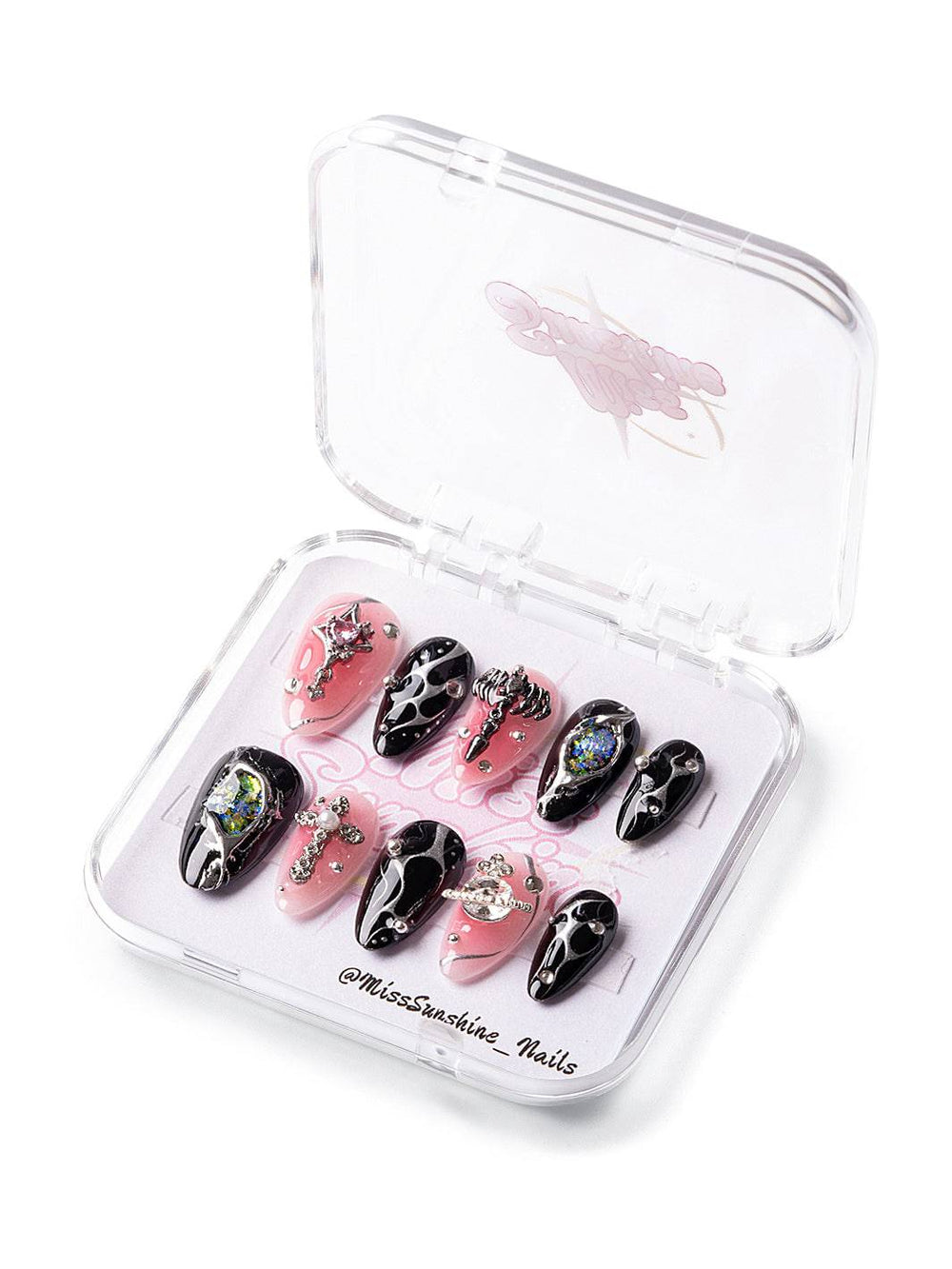 Short almond nails with black drip art and pink base