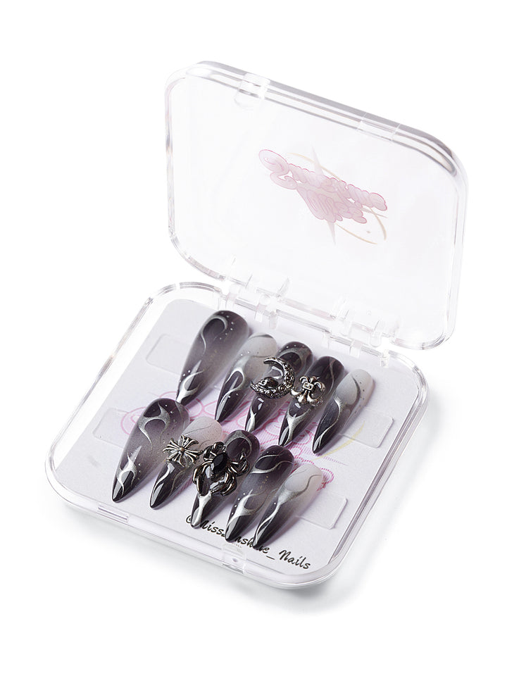 Long stiletto nails with smoky chrome and black flames