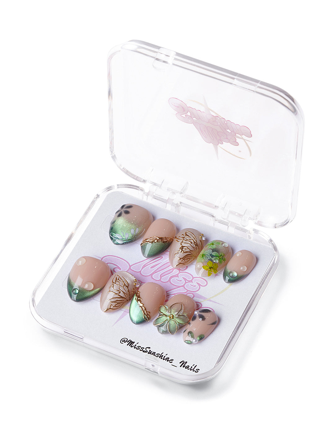 Evergreen extra short almond press-on nails with nude tones, emerald gradients, and gold botanical accents