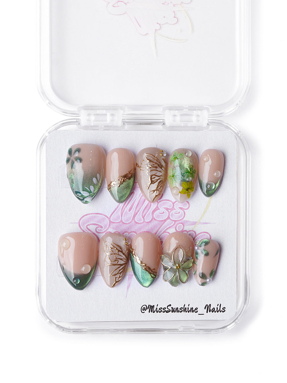 Winter forest-inspired extra short nails featuring green shimmer, gold leaf details, and 3D floral elements