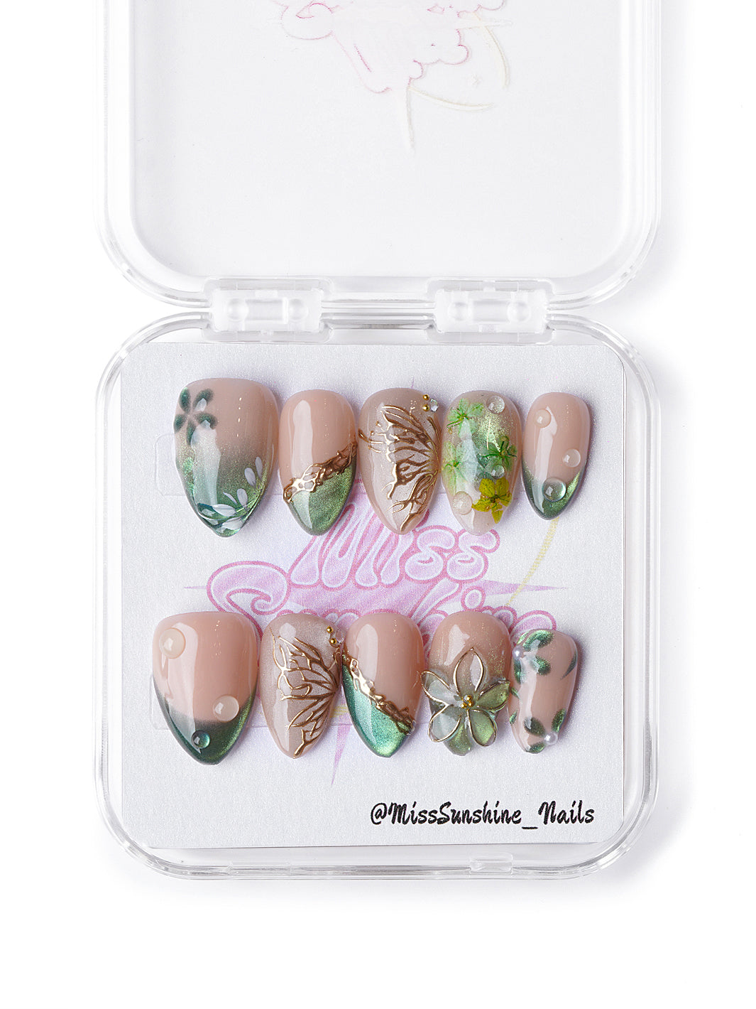 Winter forest-inspired extra short nails featuring green shimmer, gold leaf details, and 3D floral elements