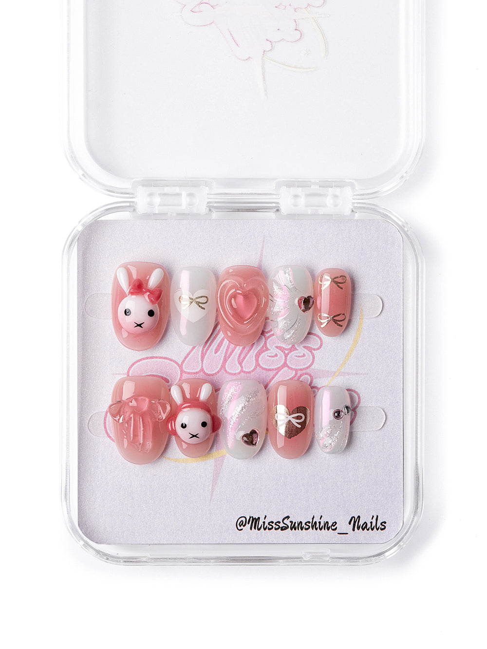 Kawaii nail design featuring glitter, bows, and soft pastels