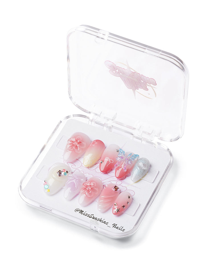 Short almond nails with pink gradient and 3D flowers