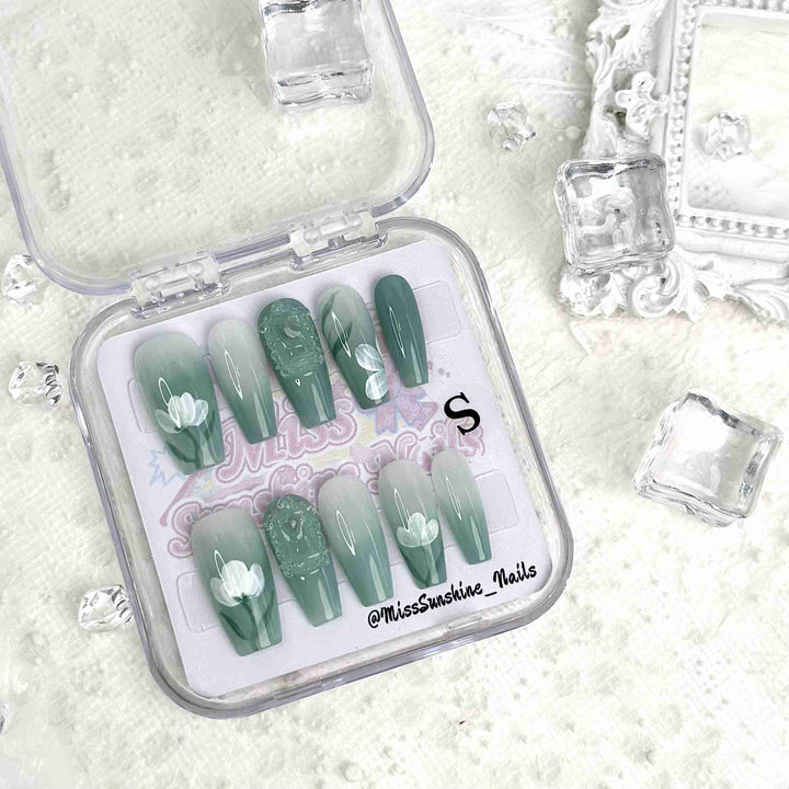 Medium-long coffin nails with jade green gradient and lotus