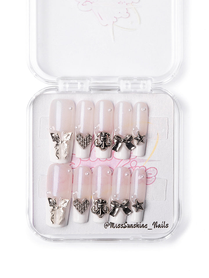 Press-on French tips with butterfly, bow, and heart details