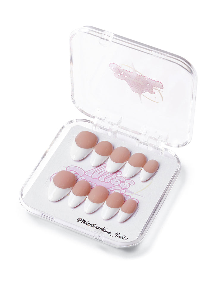 Short almond press-on nails with clean white French tips and nude base