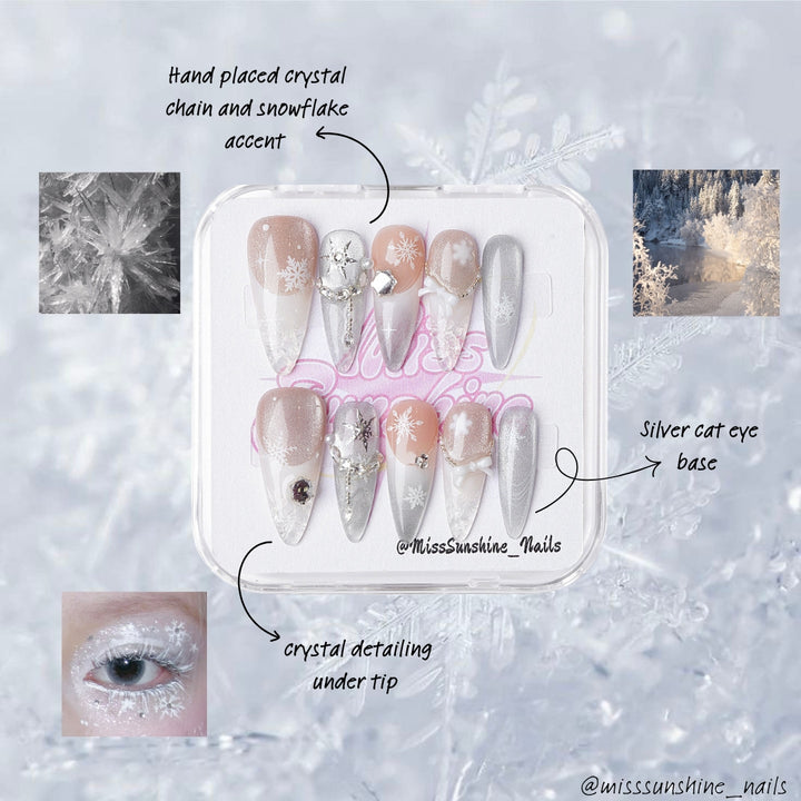 Nude-to-silver gradient nail set with 3D accents, snowflakes, and shimmering winter textures
