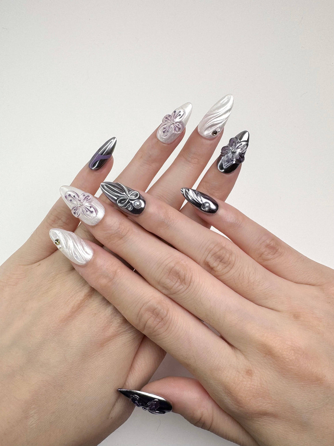 Pearly white and lilac metallic floral nails