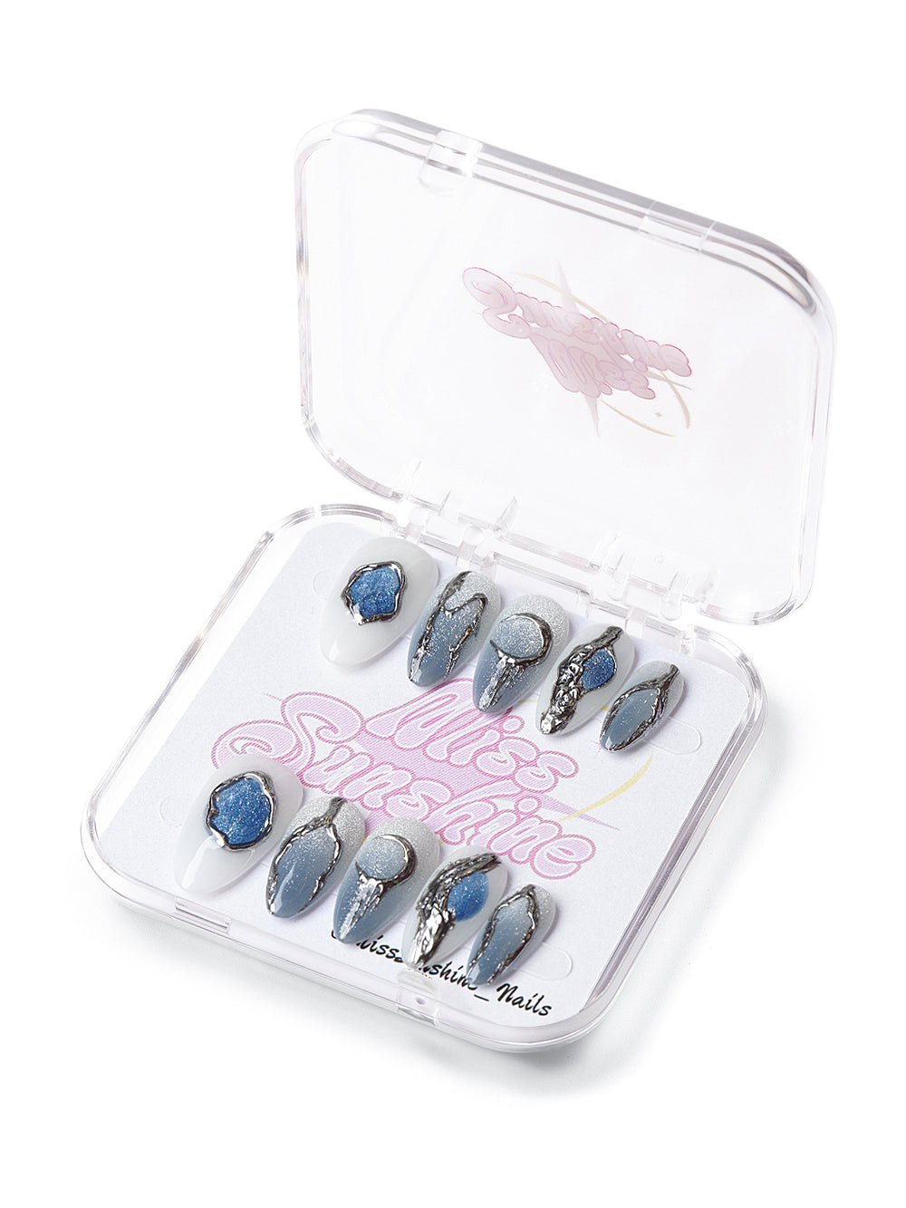 Short almond press-on nails with chrome silver detailing, icy blue gradients, and geode-inspired textures