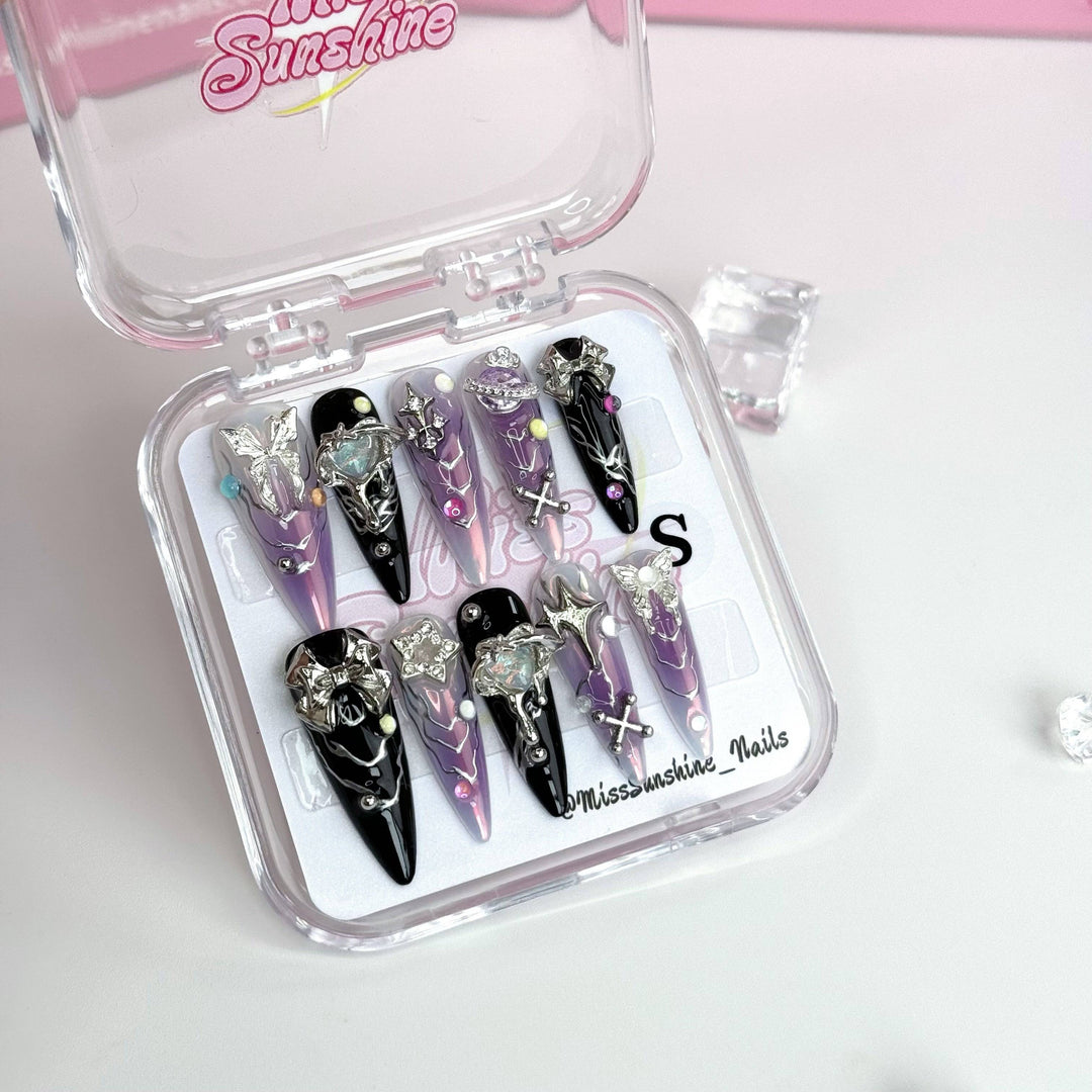 3D metallic bow and star nail embellishments