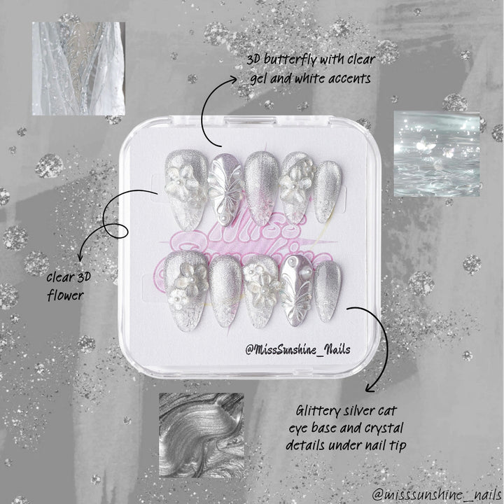 Sculptural winter press-on nail set with silver gradients, flowers, and pearlescent details