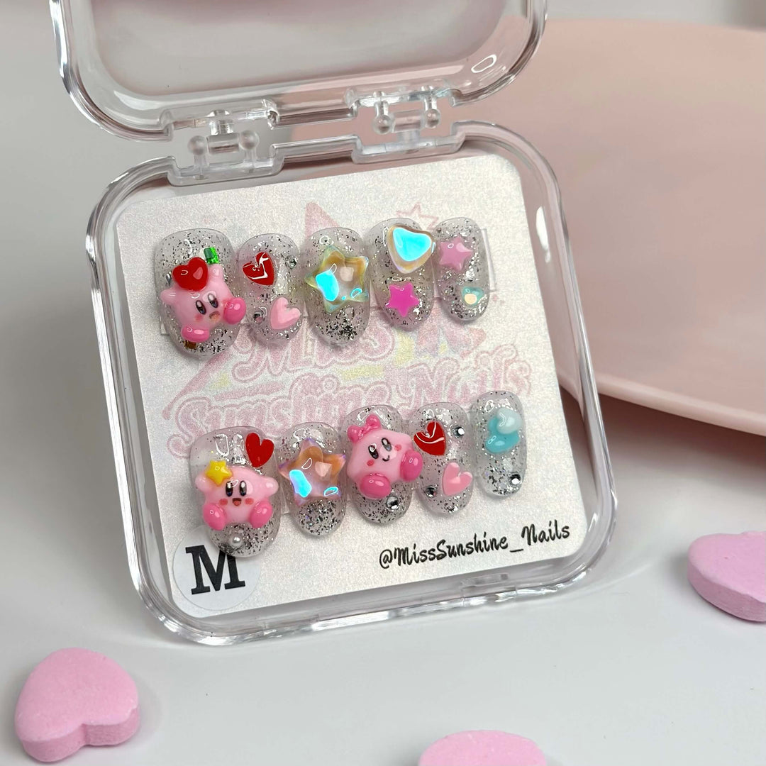 Short oval press-on nails with glitter and Kirby