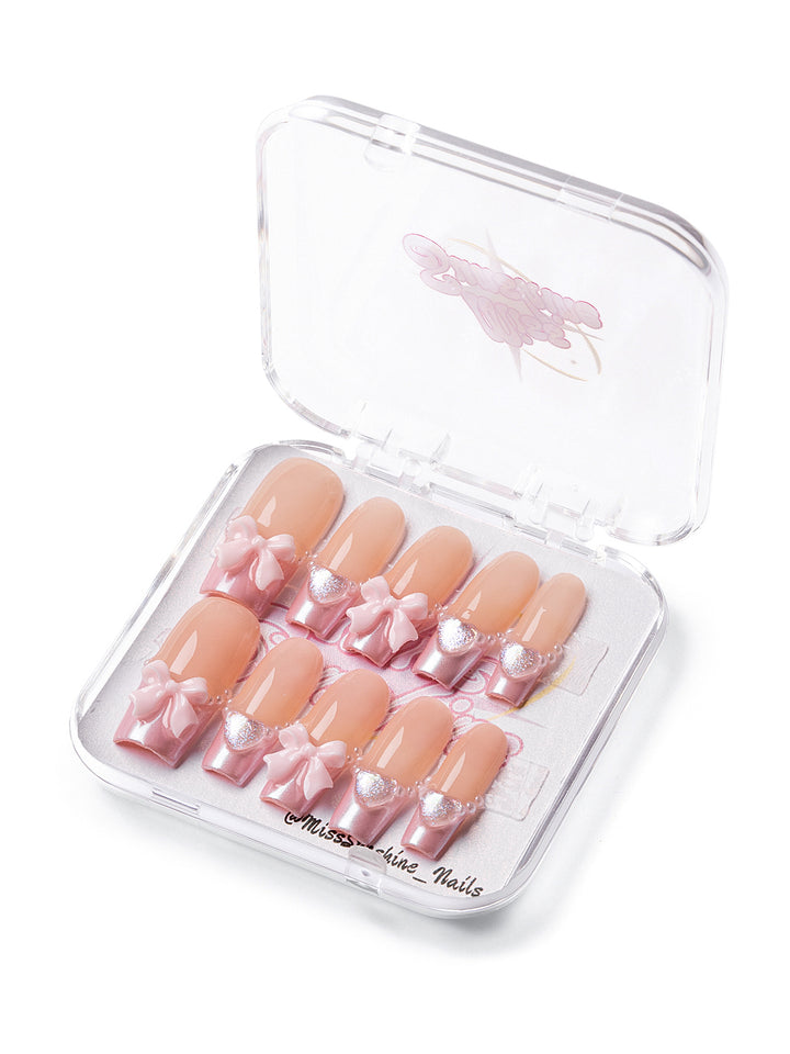 Long square nails with baby pink bows and pearls