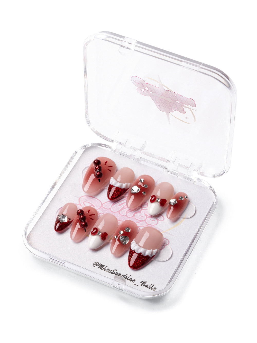 Short almond nails with red glitter and cherry bows