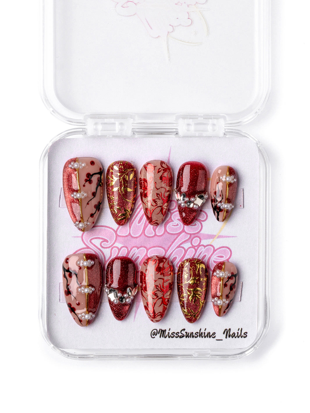 Red and gold floral short almond press-on nails inspired by Lunar New Year prosperity