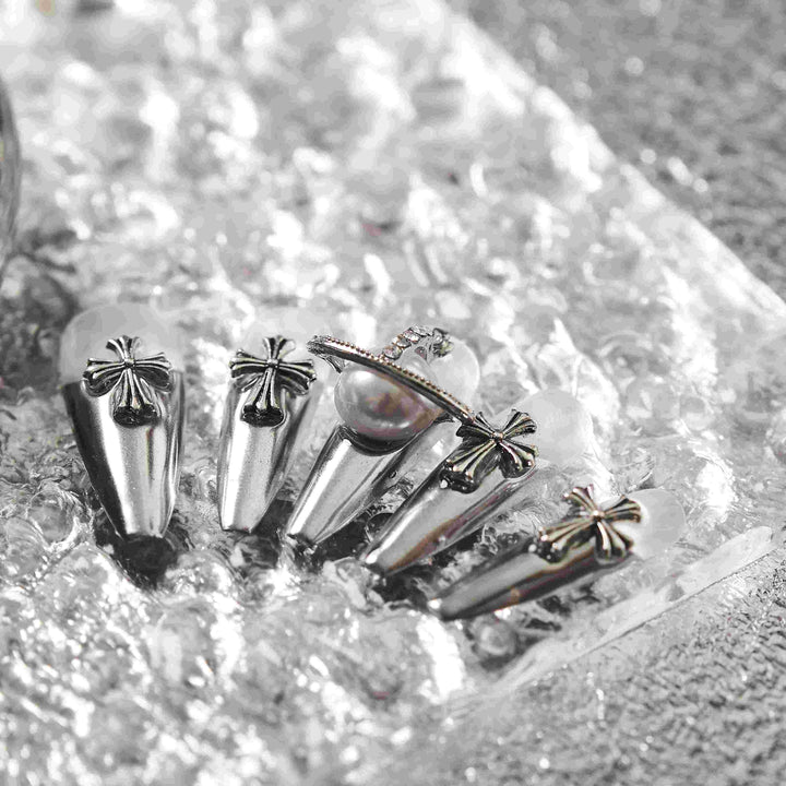 Chrome nails with pearl charm