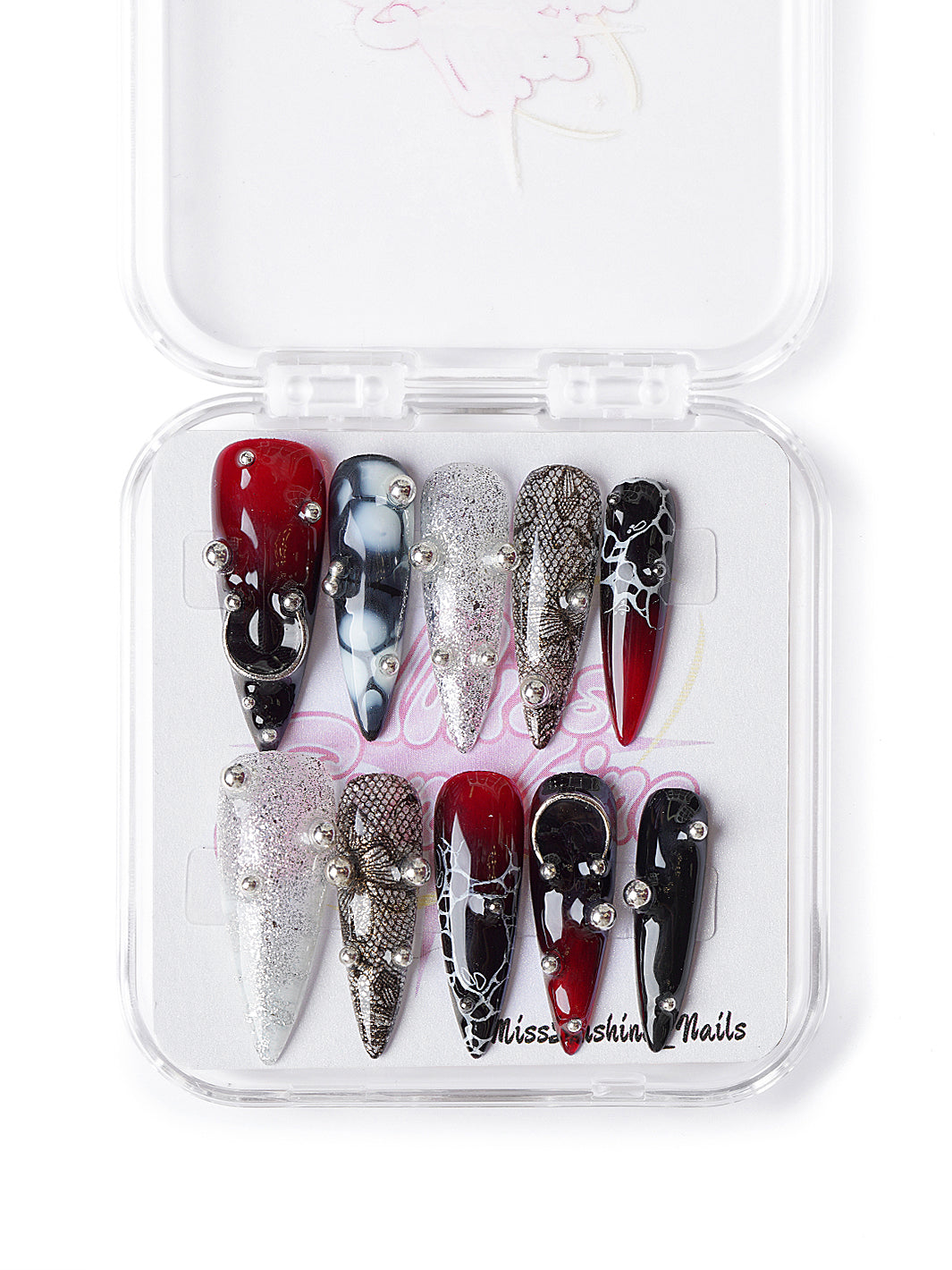 Gothic glam nails in red, black, and silver