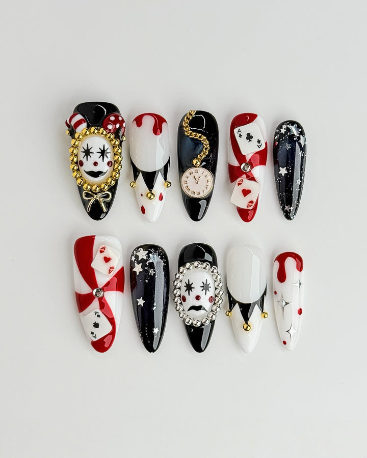 Poker Clown nail set featuring black, red, and white circus-inspired Halloween designs