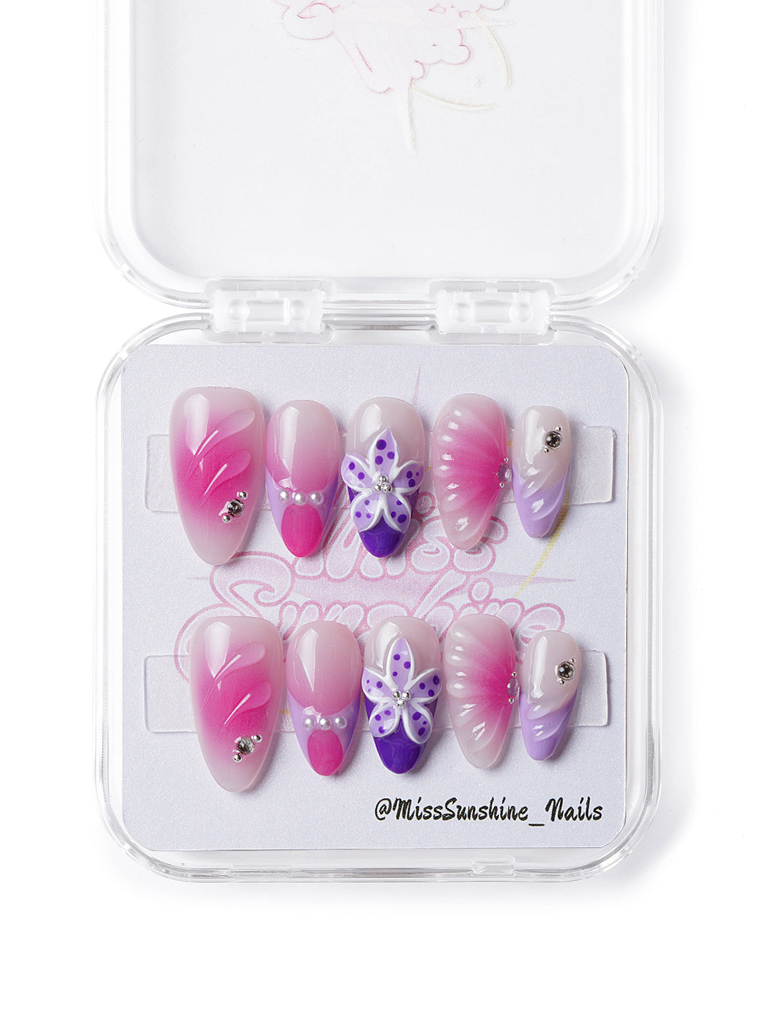 Handmade press-on nails featuring floral textures and glossy ombré gradient
