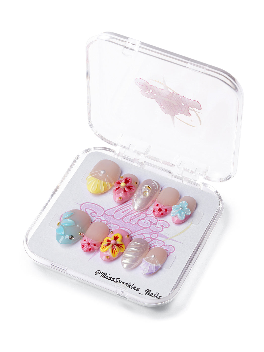 Extra short almond press-on nails with 3D flowers, seashell textures, and pastel island colors