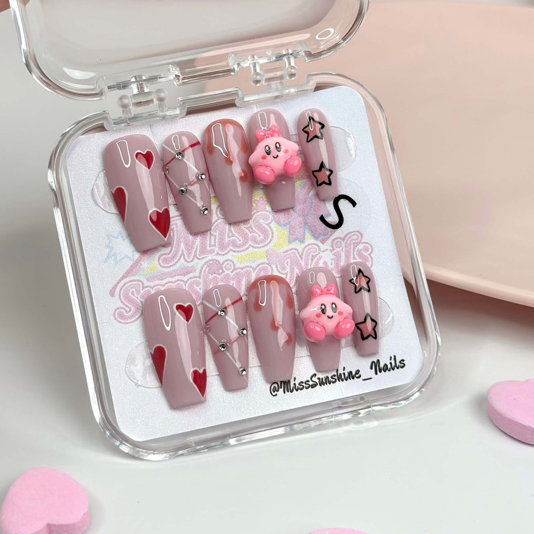 Press-on nails with 3D Kirby and red hearts