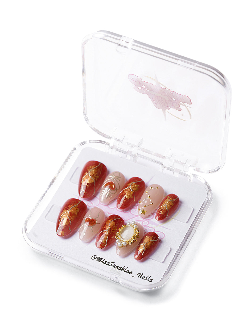 Short almond nails with gold foil and Cancer constellation