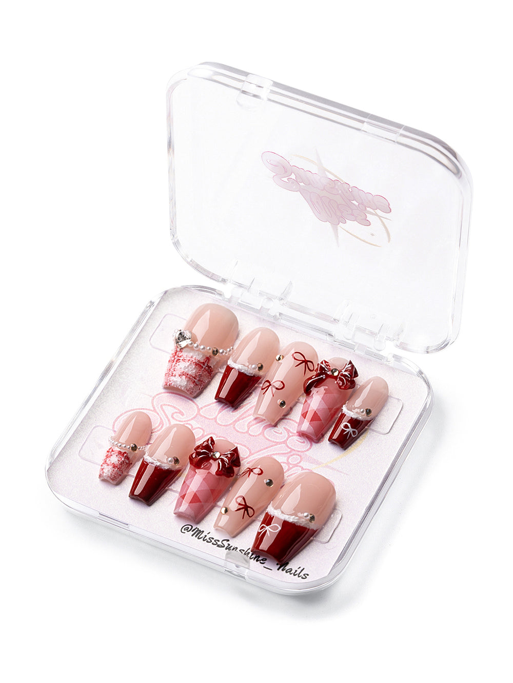 Medium-long holiday nails with red bows and pearls