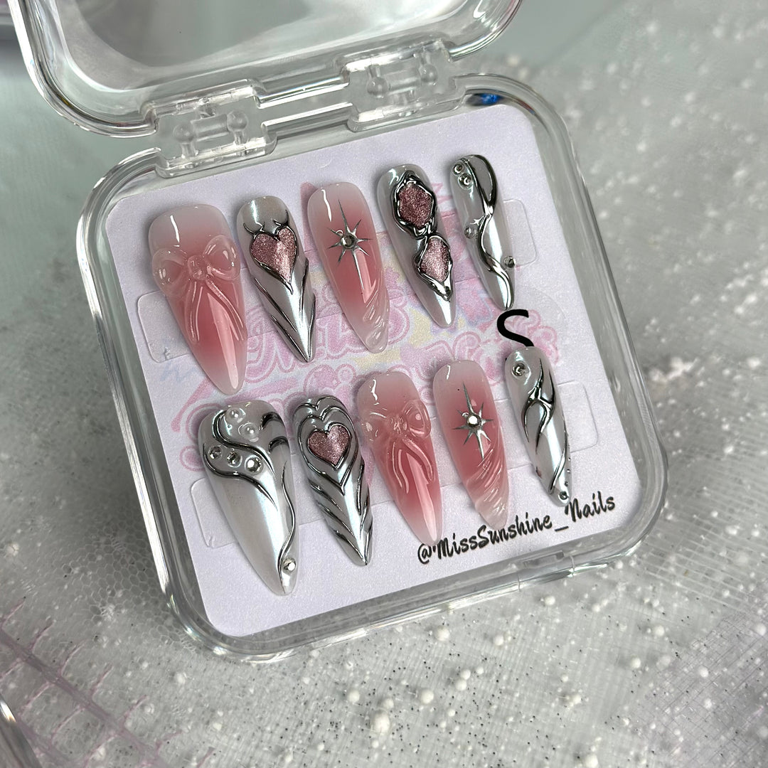 Y2K stiletto heart nail art