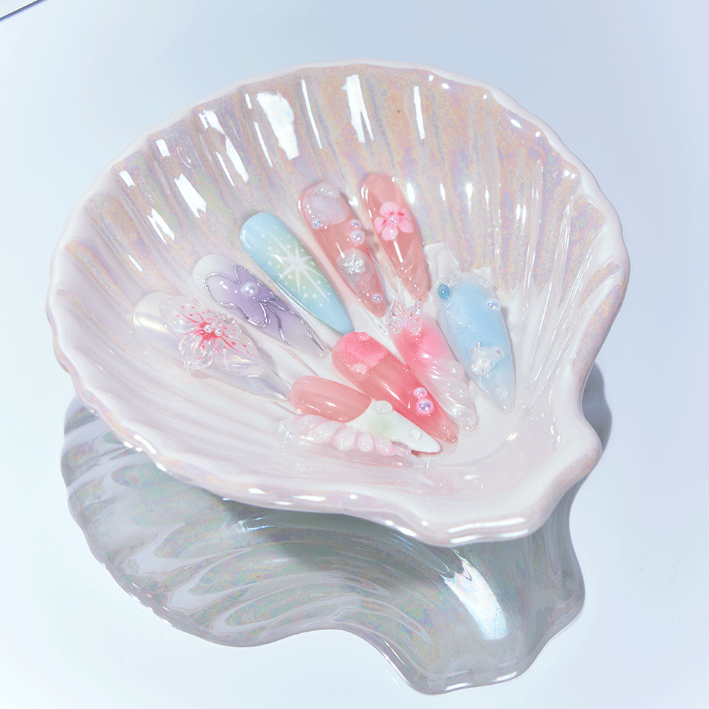 Long stiletto nails with pastel ocean blue and pink accents