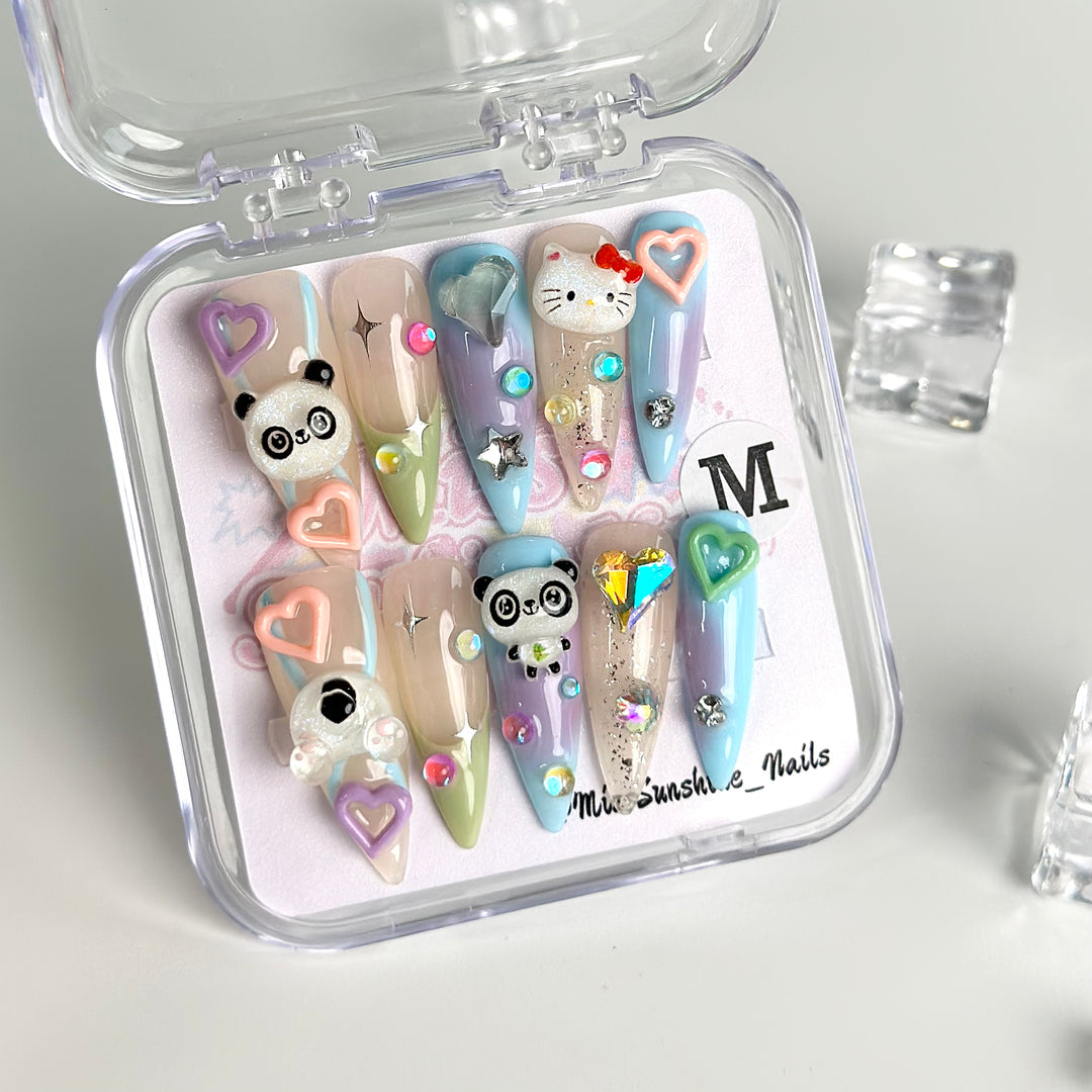 Long stiletto nails with 3D panda and kitty charms