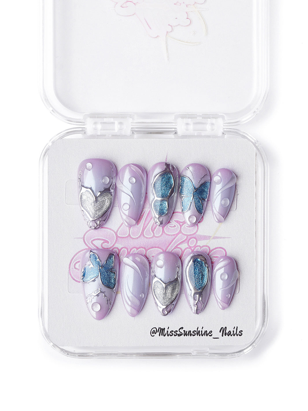 Short almond lavender nails featuring 3D butterflies, sculpted silver hearts, and pastel gradients