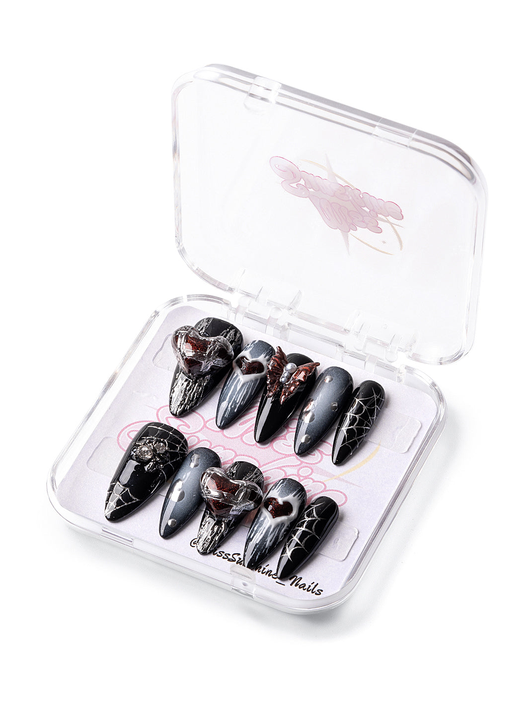 Black ombré nails with red heart charms