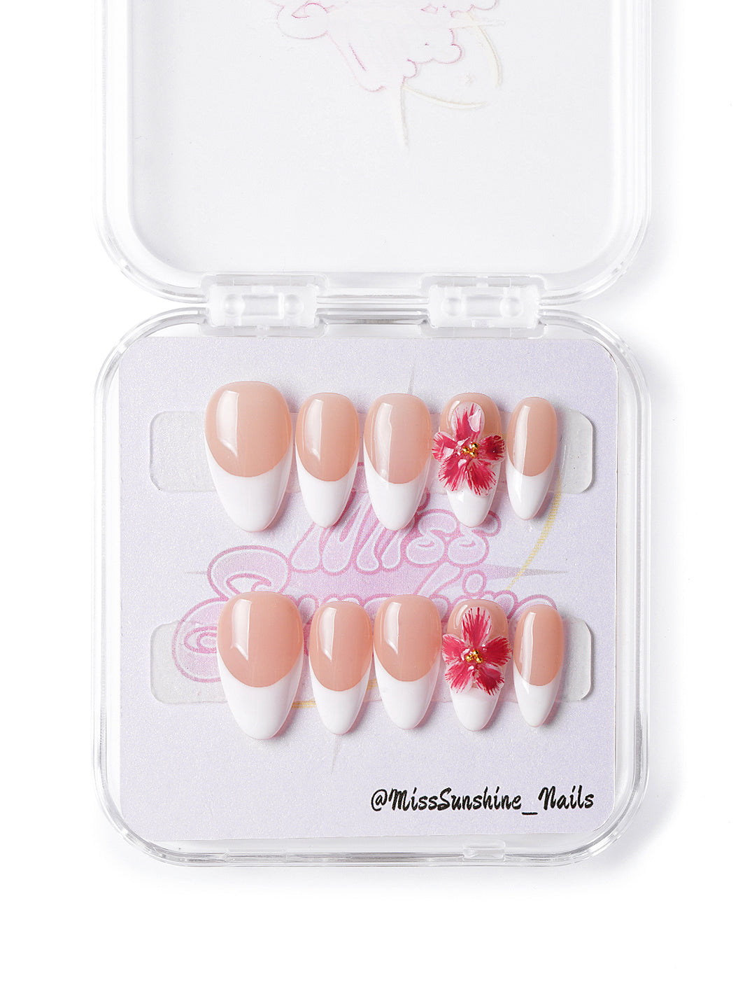 Handmade press-on nails featuring nude base, classic French tips, and minimalist floral detail