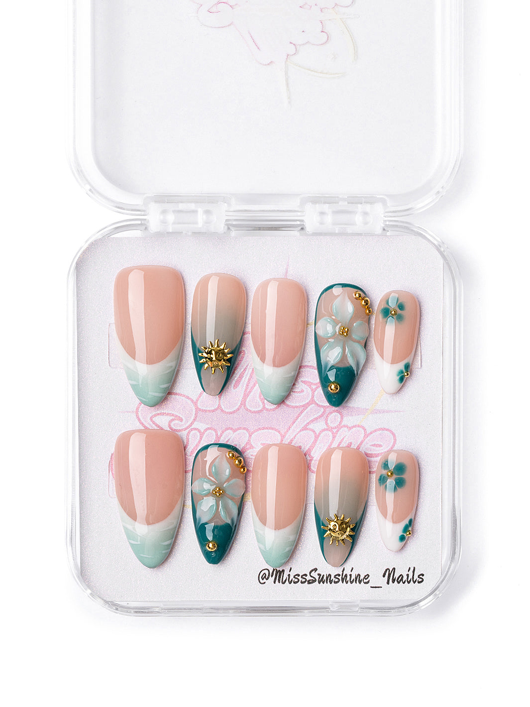 Mint Coast press-on nails with seafoam French tips and gold sun accents