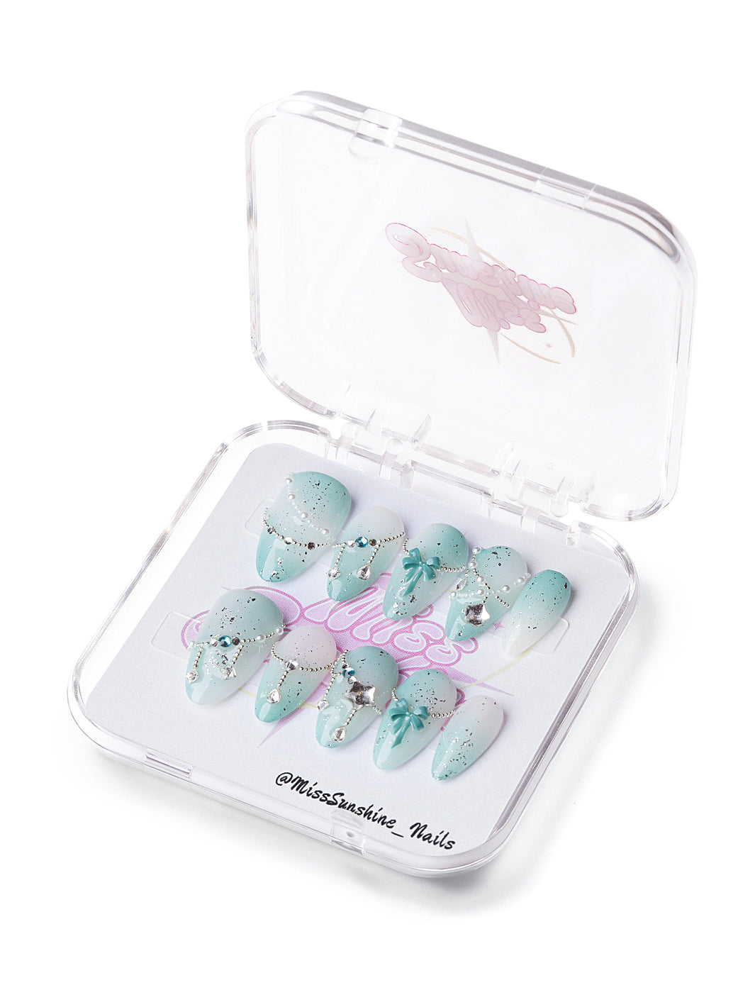 Mint Starfall short almond press-on nails with icy mint gradients, stars, chains, and gemstone accents