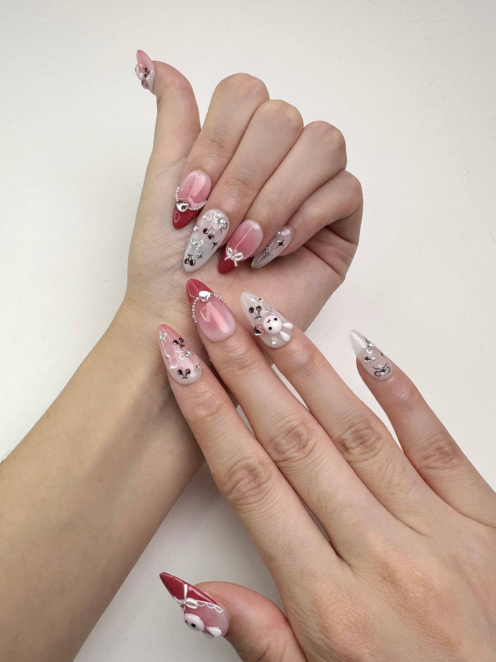 Cute nail art with bows, hearts, and bunny details