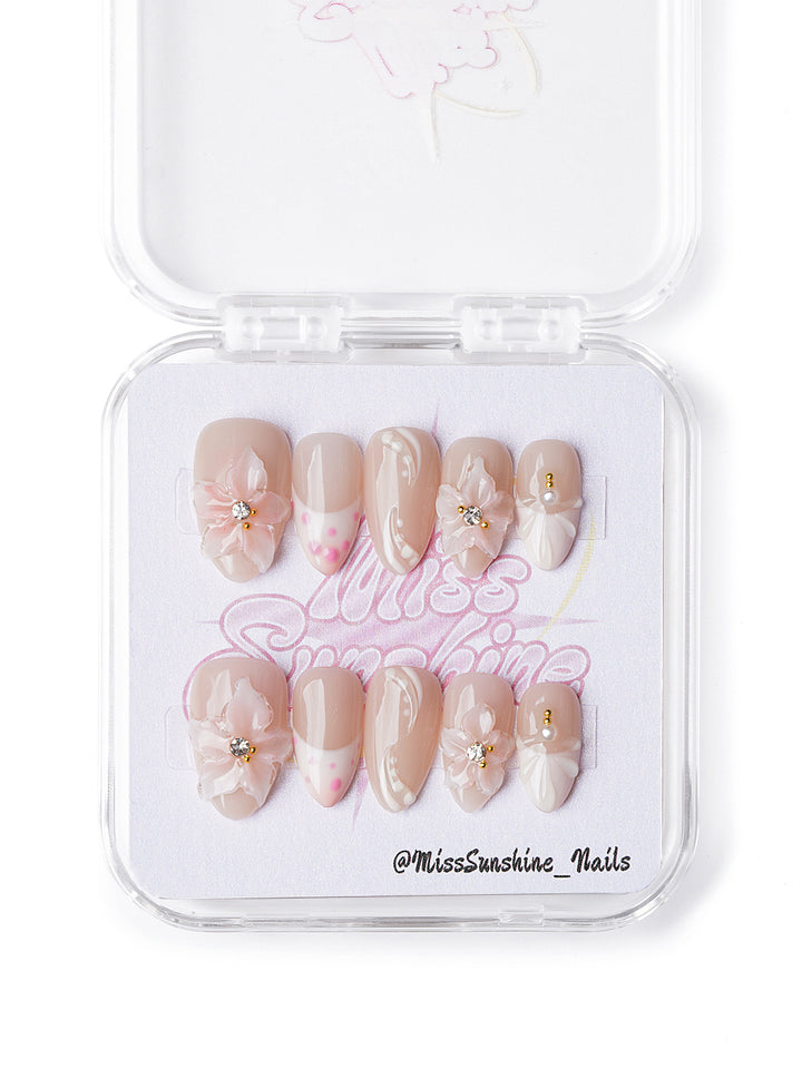 Handmade extra short almond nails with sculpted blush florals and soft nude base