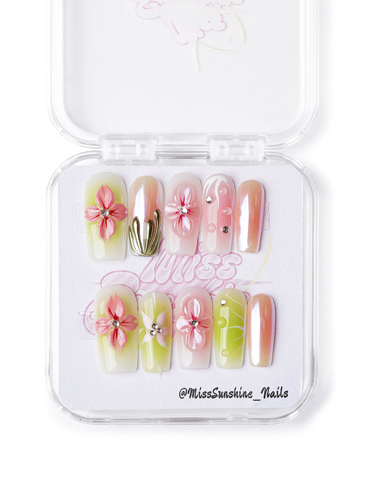 Handmade medium square nails with guava pink, chrome green, and sculpted floral designs