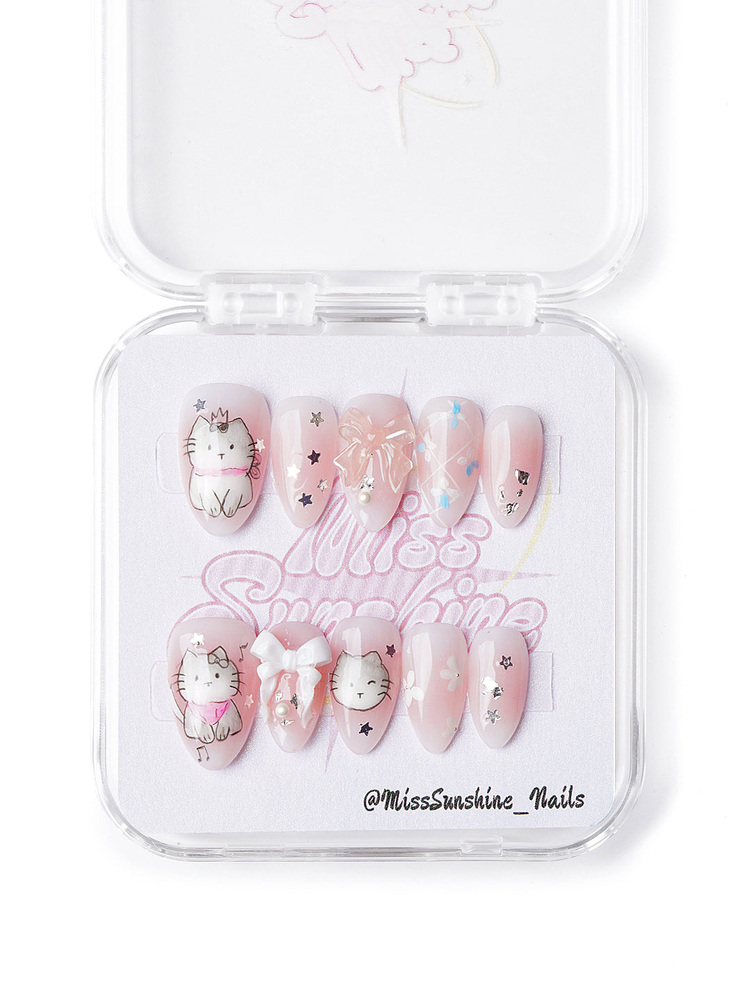 Handmade extra short almond nails with pastel pink base, kitten graphics, and 3D embellishments