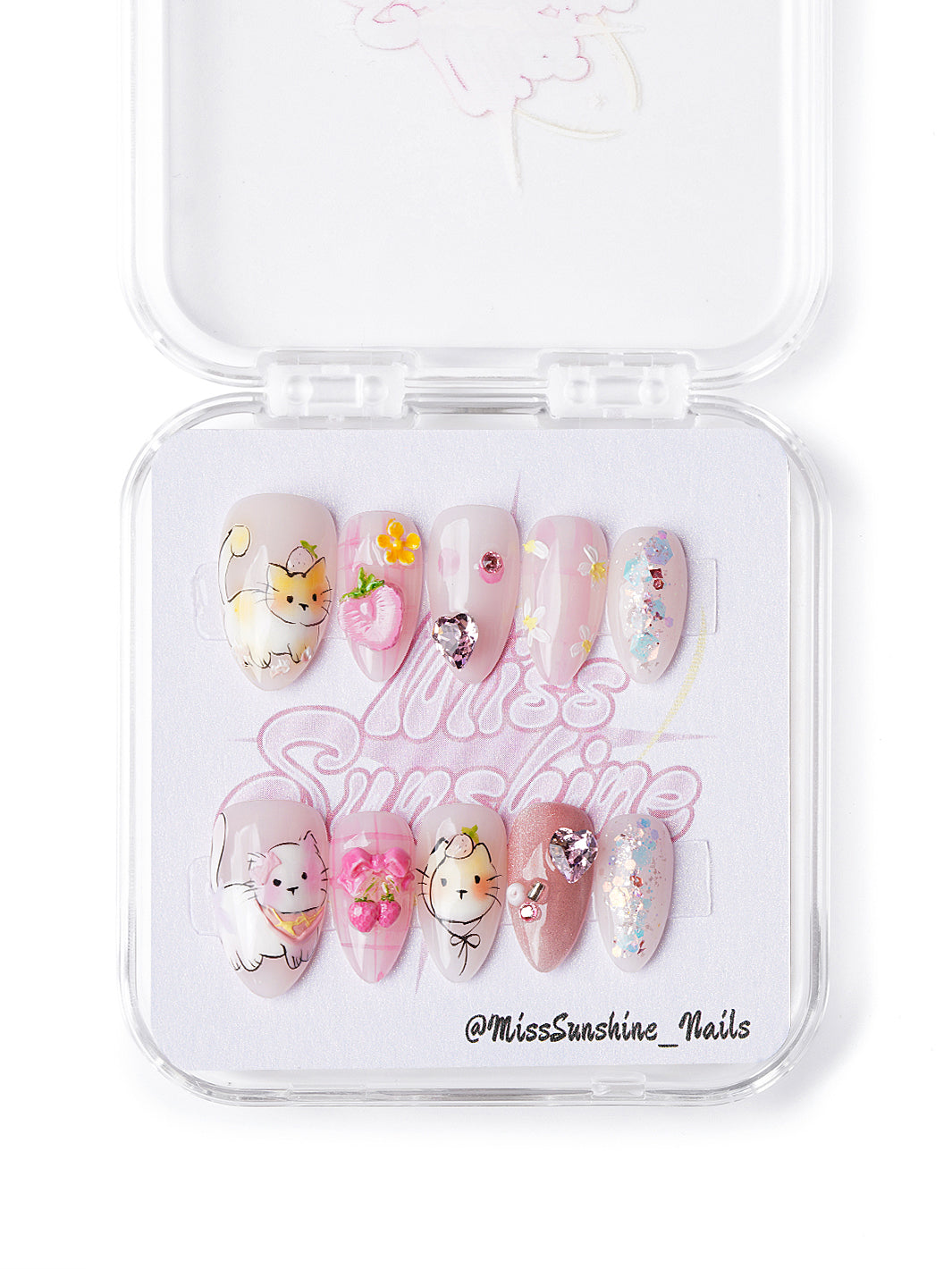 Handmade kawaii nails with cat designs, fruit charms, sparkle hearts, and gingham accents