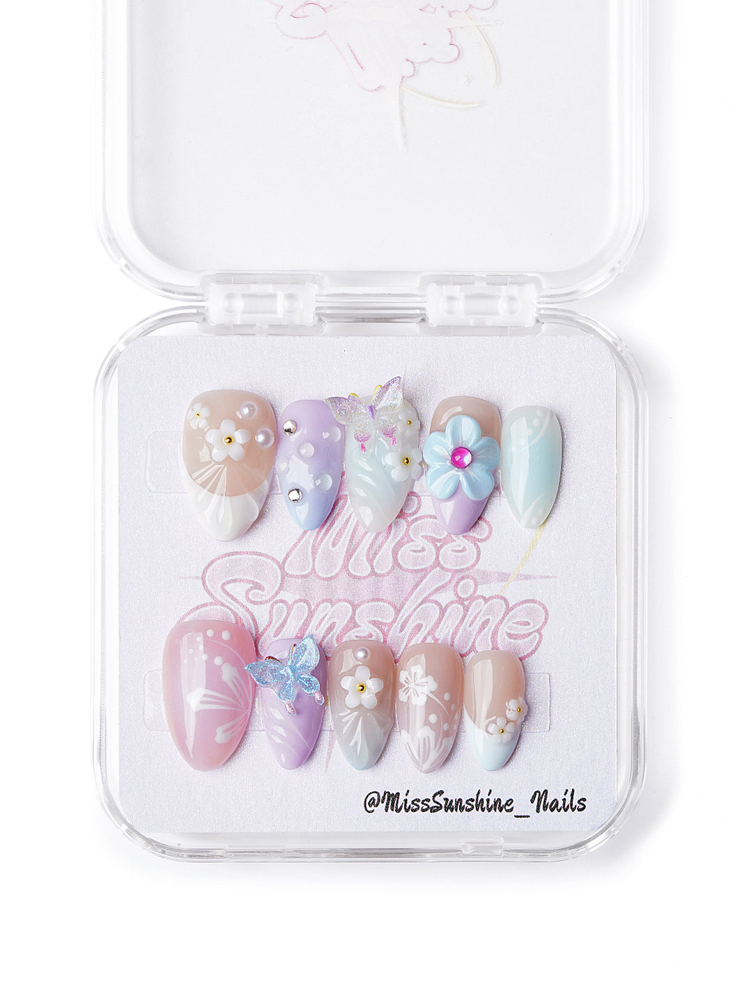 Handmade pastel press-on nails in extra short almond shape with butterflies, pearls, and spring florals