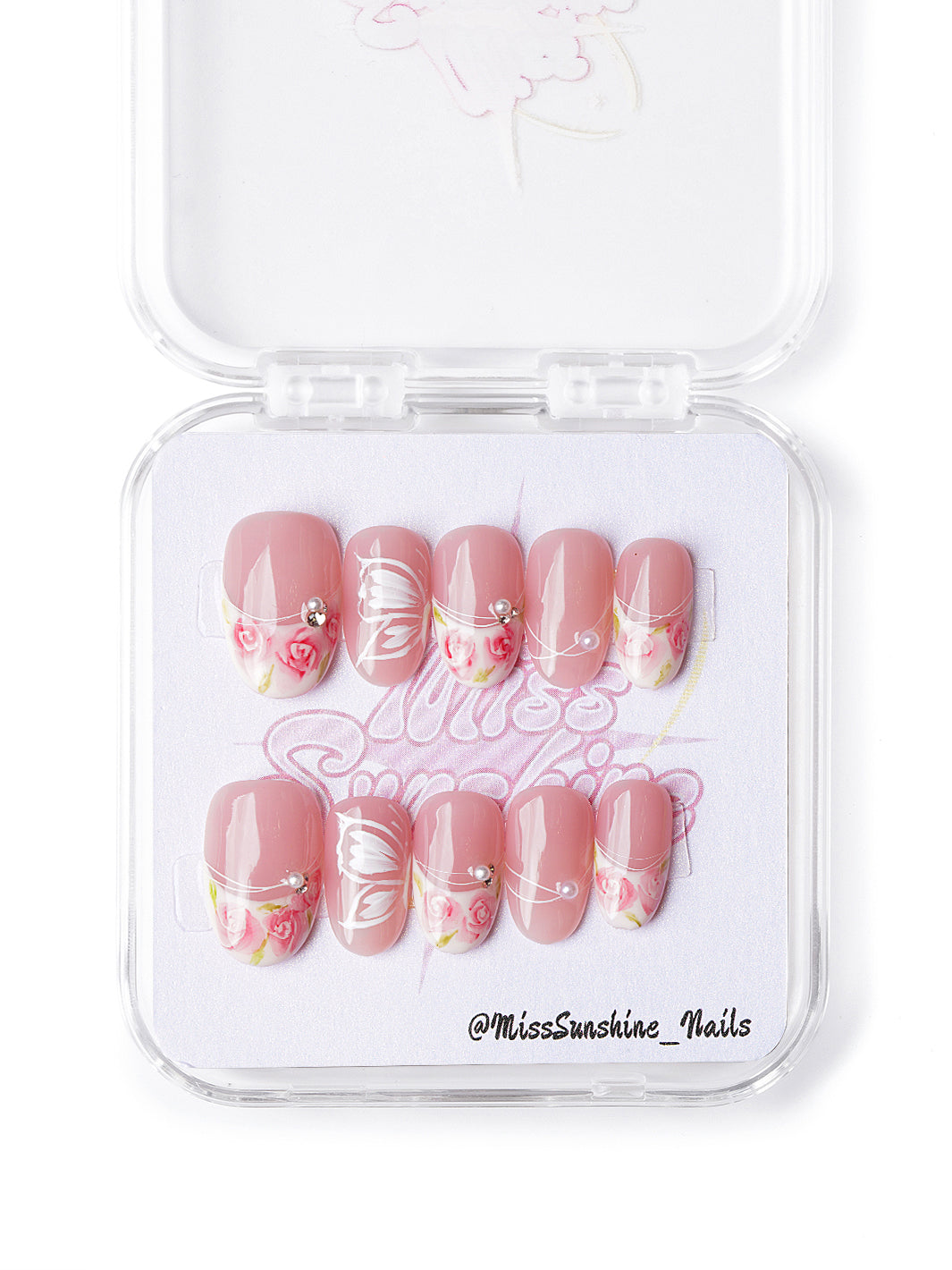 Handmade pink floral nails with butterfly wings and pearls in short oval shape, cottagecore-inspired