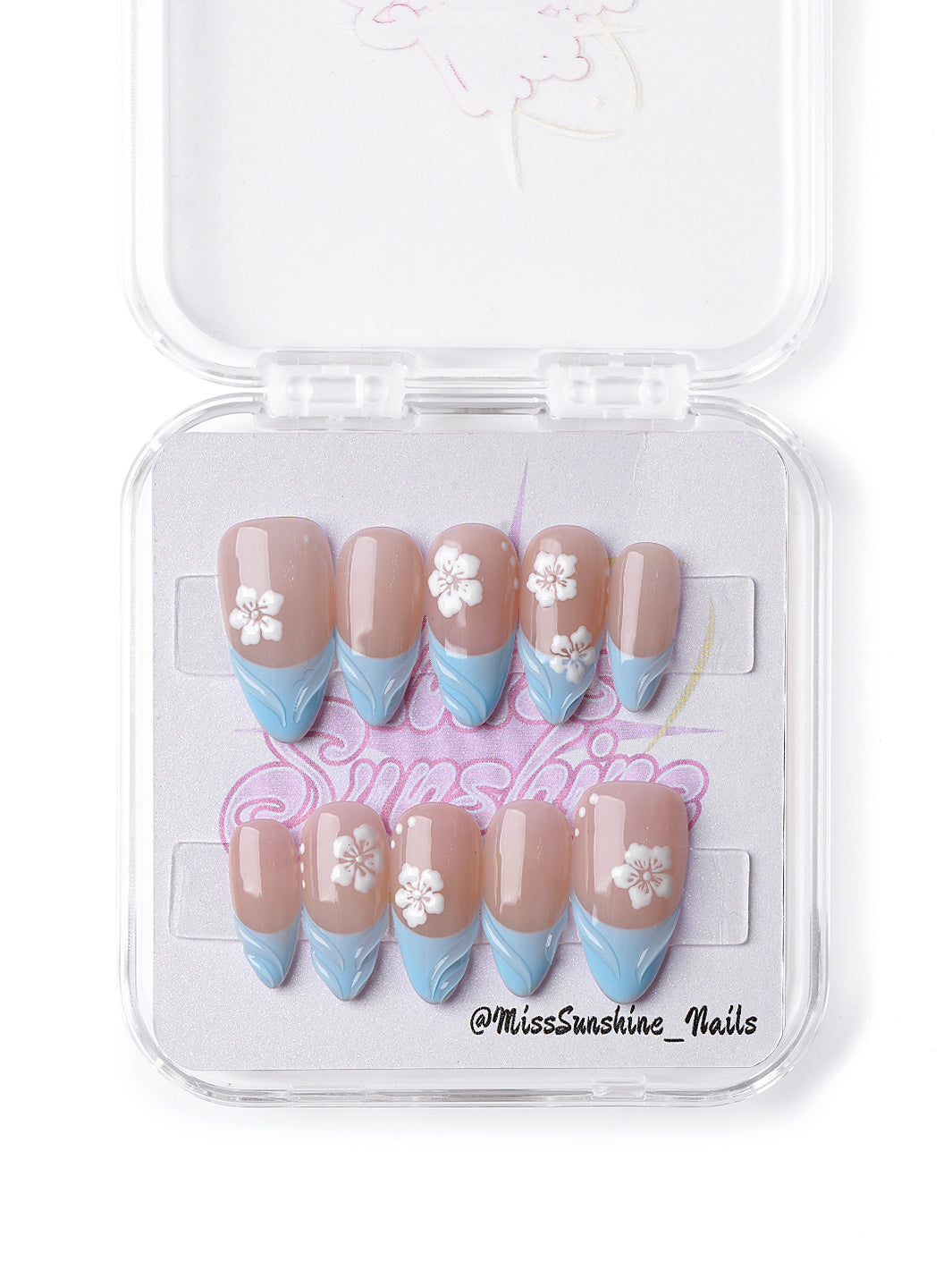  Pastel press-on nails featuring baby blue waves and delicate floral accents.