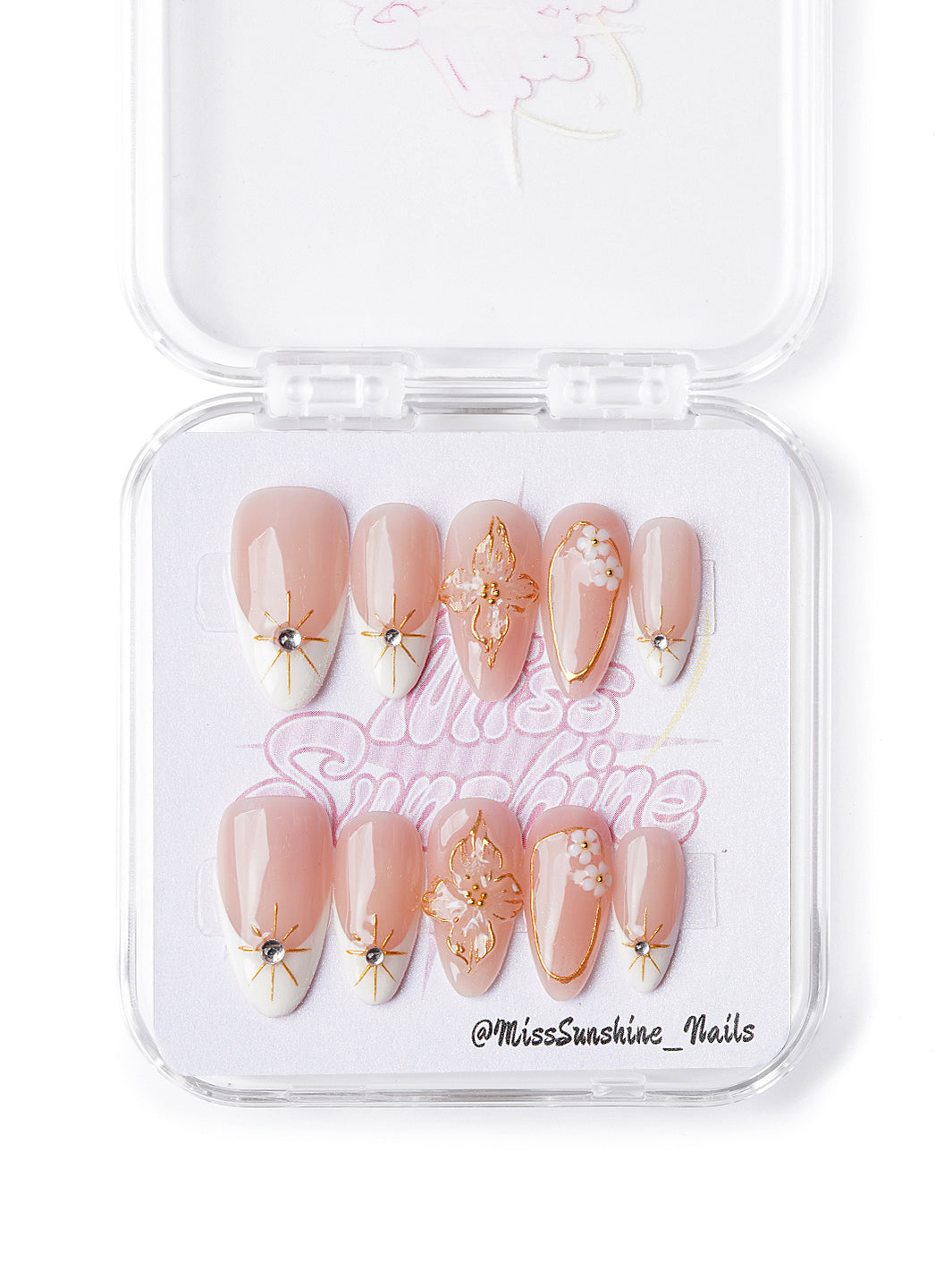 Handmade short almond nails with gold stars, floral tips, and 3D peach and white blossoms
