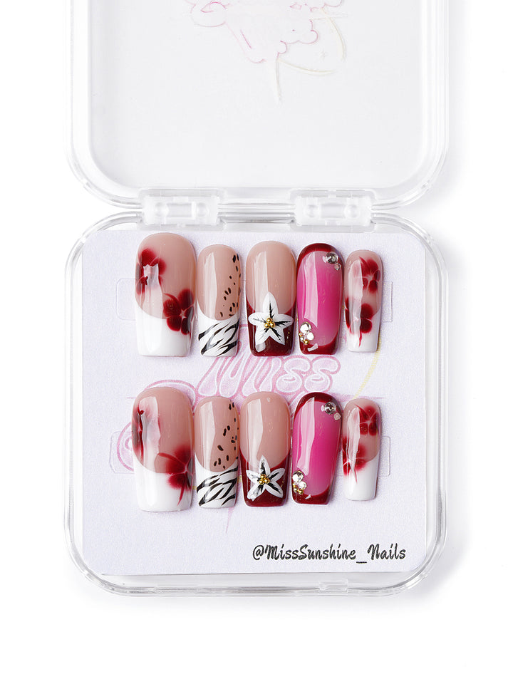 Tropical-inspired press-on nails with floral and animal prints in medium square shape